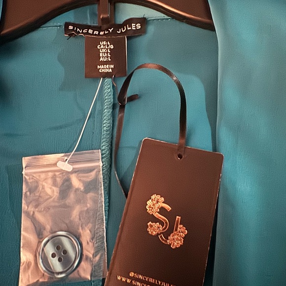 Size 12 blazer (color) Teal
Size 12 tutu skirt (color) Teal - Picture 2 of 3